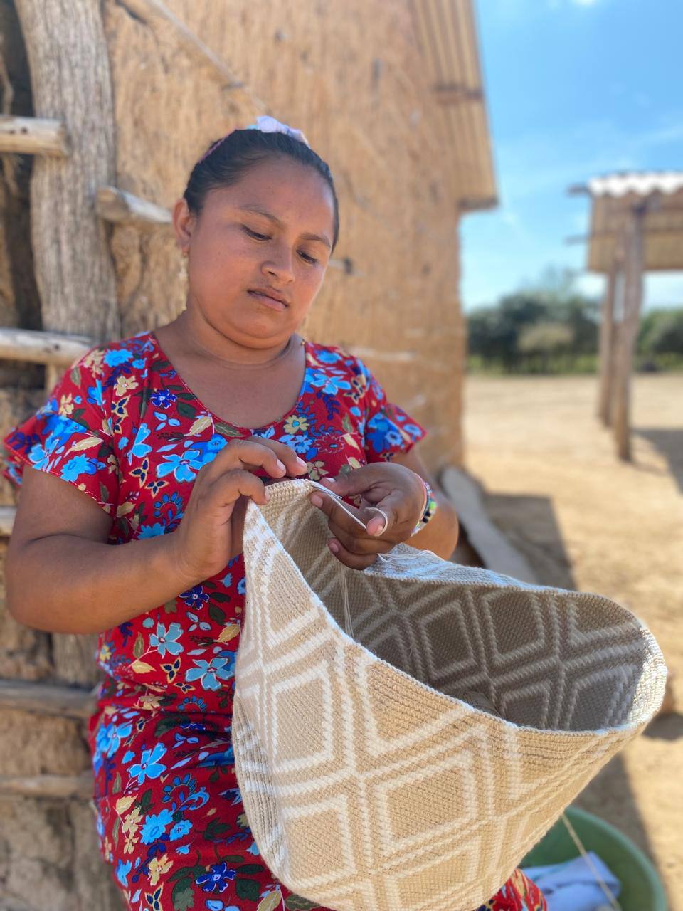 A Wayuu artisan weaving in La Guajira, Colombia