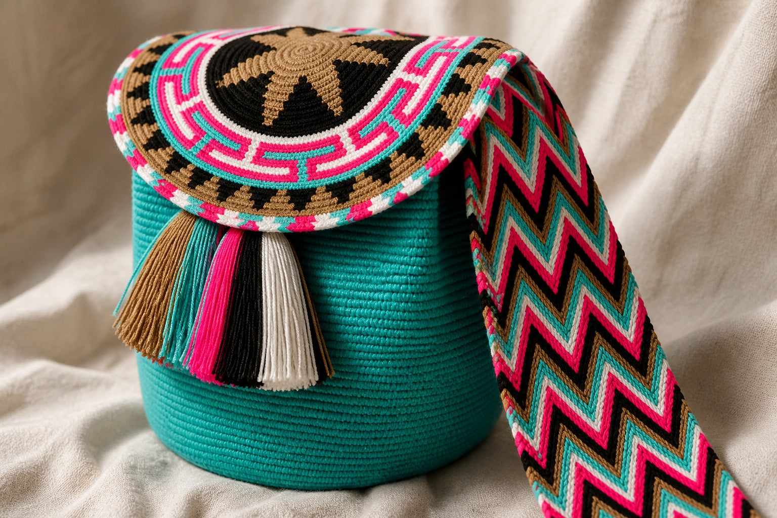 Wide woven strap, joined flat — no hardware. Each colourway in the close-out is its own piece.